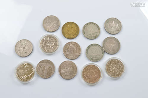 Fourteen commemorative £5 coins, four in plastic coin cases,...