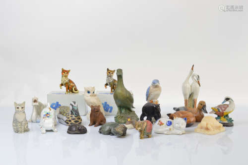 A collection of animal figurines, including two Black Forest...