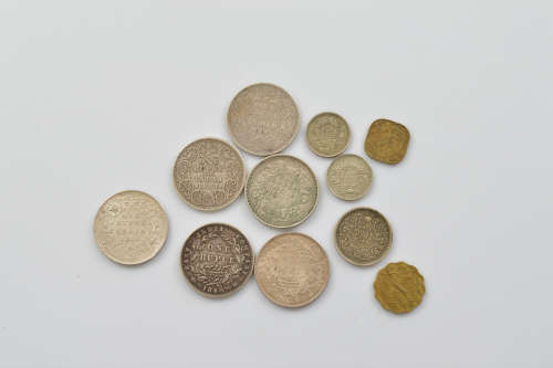 Eleven Victorian and George V and VI Indian circulated coins...