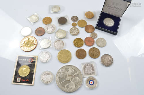 A collection of commemorative silver and base metal coins an...