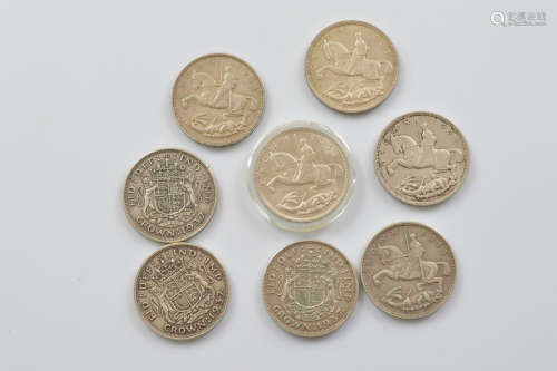 A collection of George V and George VI crowns, including fiv...