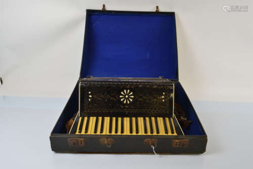 An Alvari accordion, with fretwork decoration, ivorine keys ...