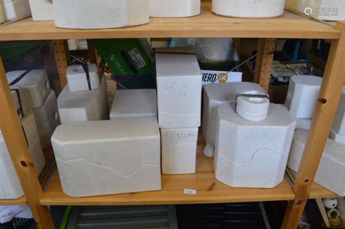 A good collection of plaster doll molds, various sizes and l...
