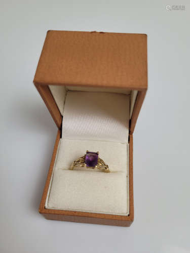 A 9ct gold amethyst dress ring, the mixed cut rectangular cl...