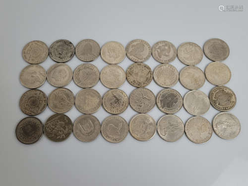 A collection of replica coins from around the world, compris...