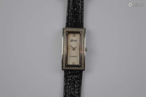 A certificated lady's diamond bezel wristwatch with leather ...