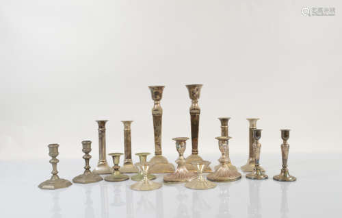 A collection of silver plated candlesticks, including eight ...