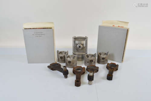 A collection of five gardeners piston heads, and two gardene...