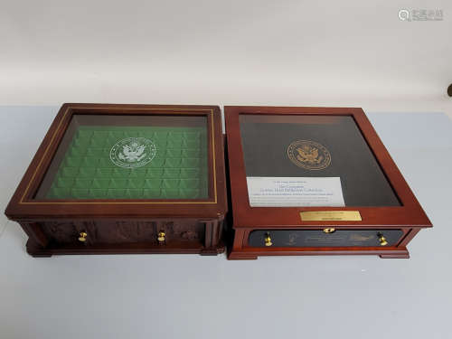 A collection of unpopulated coin display cases and boxes, fo...