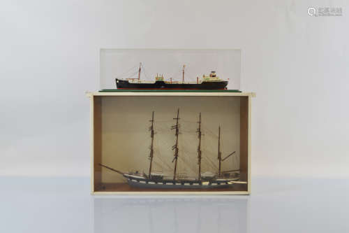 A hand painted scratch built ship model set in glass and woo...