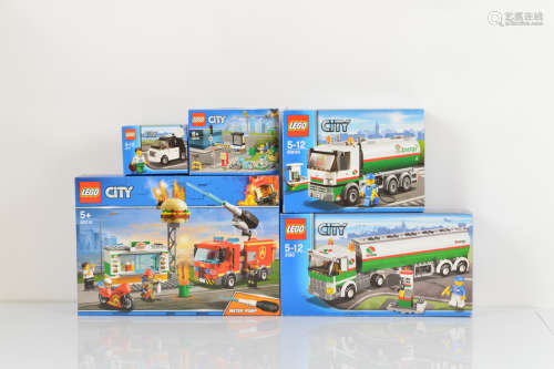 Five boxed Lego City models, including Burger Bar Fire Rescu...