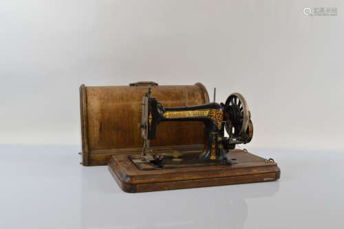 A Bradbury's 'SOEZE' table top hand crank sewing machine, nu...
