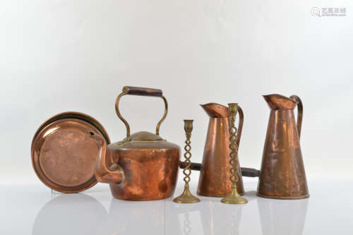 A quantity of copperware, including two tapered jugs with st...