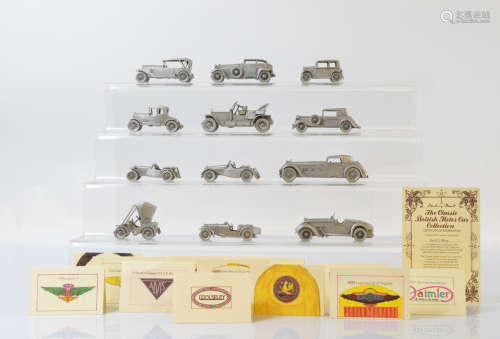 A collection of Danbury Mint pewter car models, with certifi...