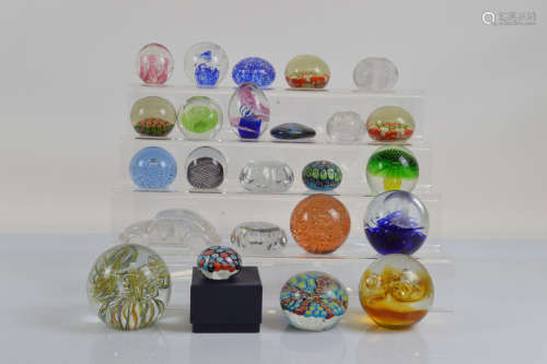 A collection of paperweights, including various millefiori, ...