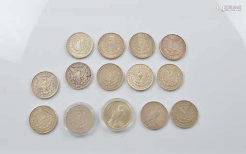 A collection of fourteen Morgan head and Liberty United Stat...