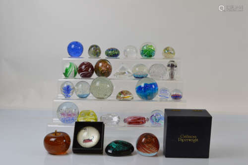 A collection of twenty nine paperweights, to include a Caith...