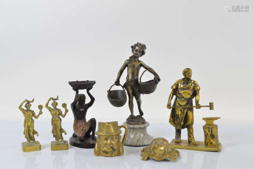 A collection of figural metalware, including a brass model o...