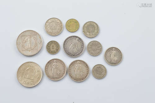 A small collection of Swiss coinage, including a commemorati...