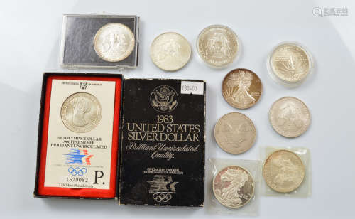 A collection of American contemporary silver dollars, includ...