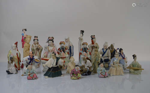 A large collection of 20th Century Asian figurines, in porce...