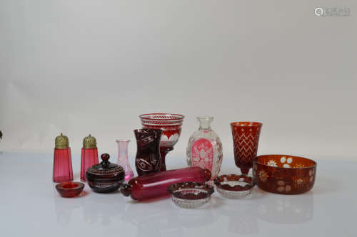 A collection of cranberry glass, including a rolling pin, 29...