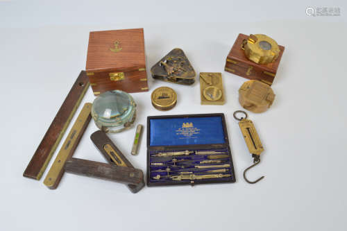 A collection of brass and mahogany spirit levels and measure...