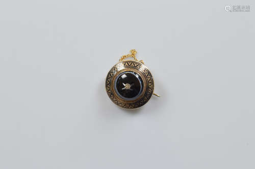 A Victorian onyx and diamond gold and enamel mourning brooch...