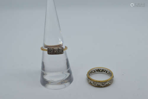 An 18ct gold and diamond platinum set three stone dress ring...