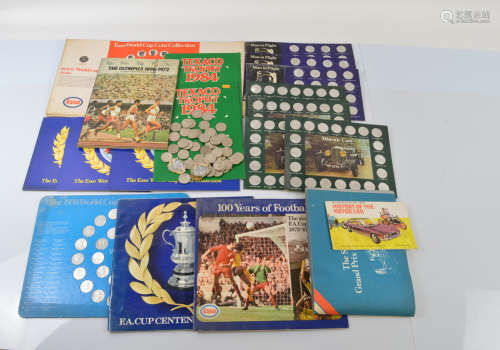 A collection of commemorative and souvenir shell coin sets, ...