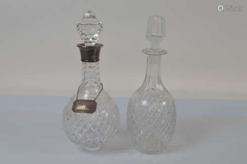 A contemporary silver collared cut glass decanter, of spheri...