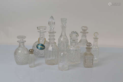 A collection of ten miscellaneous decanters and some associa...