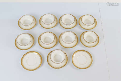 A collection of nine small French porcelain saucers and bowl...