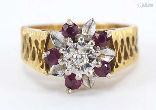 18ct gold diamond and ruby flower head ring, size N, 6.8g