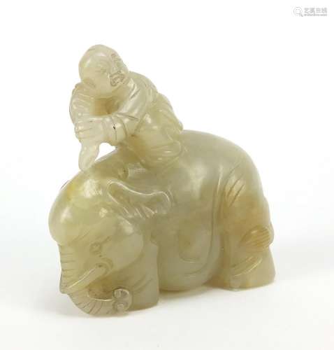 Chinese celadon and russet jade carving of a boy holding a r...