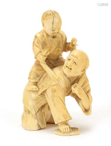 Japanese carved ivory okimono of a father and child playing,...