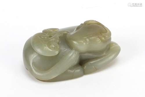 Chinese celadon and russet jade carving of a buffalo, 7cm wi...