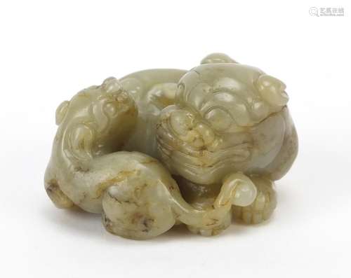 Chinese celadon and russet jade carving of two mythical lion...