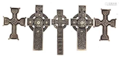 Five silver Celtic cross pendants, the largest 4.8cm high, t...