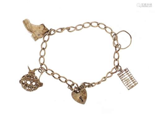 Silver charm bracelet with charms including an abacus and lo...