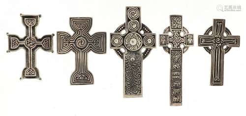Five silver Celtic cross pendants, the largest 4.6cm high, t...