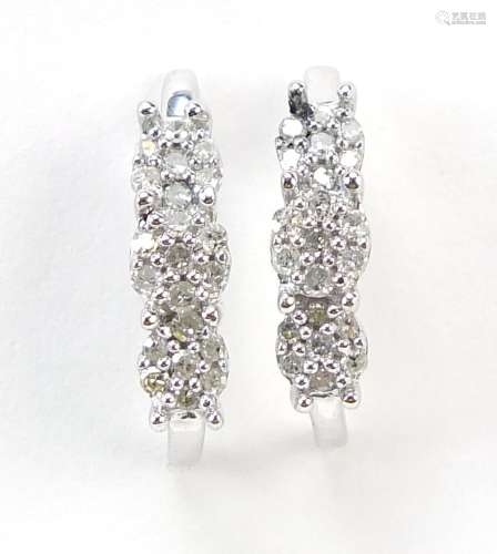 Pair of silver diamond stud earrings, 12mm high, 1.2g