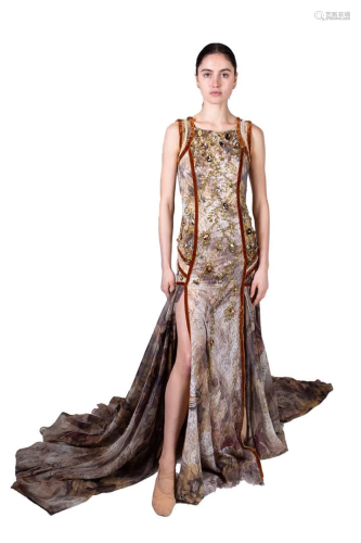 Brown evening dress with decoration of gold-colored
