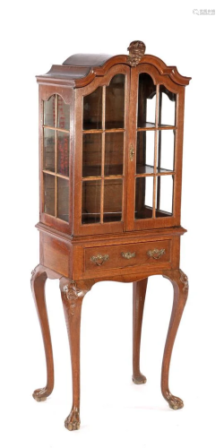 Oak display cabinet on a beautiful base with carved