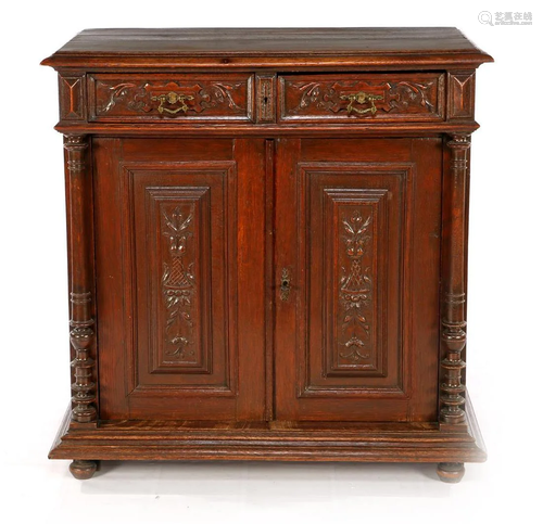 Oak sideboard with carved decoration on the front