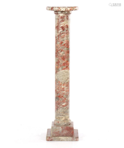 Red and gray-colored marble pedestal