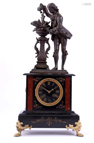 Marble table clock with a cast-iron statue
