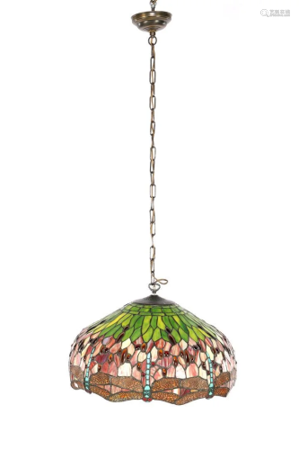 Glass tiffany hanging lamp surrounded by dragonflies