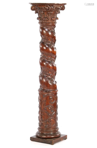 Twisted oak column with decoration of leaves