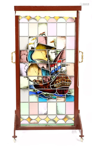 Stained glass window depicting a three-master ship, in